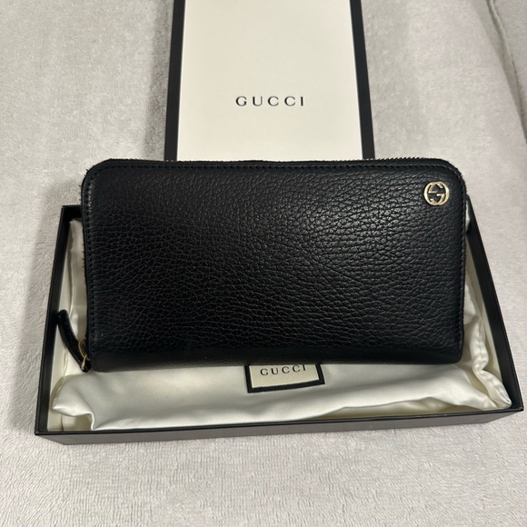 Gucci Handbags - Gucci zippy wallet with signature GG on front